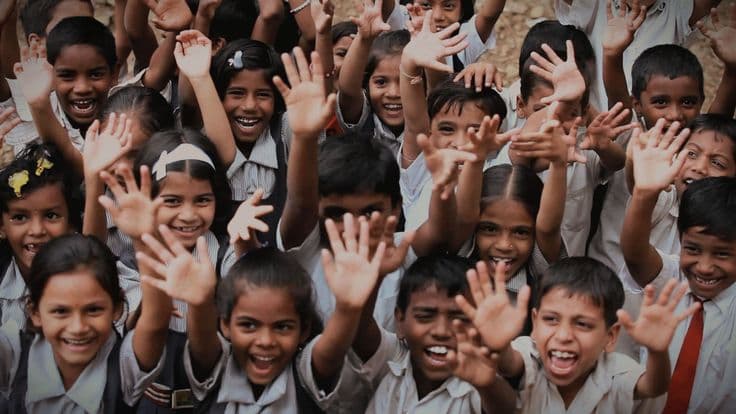 Children joyfully enjoying Meet India snacks